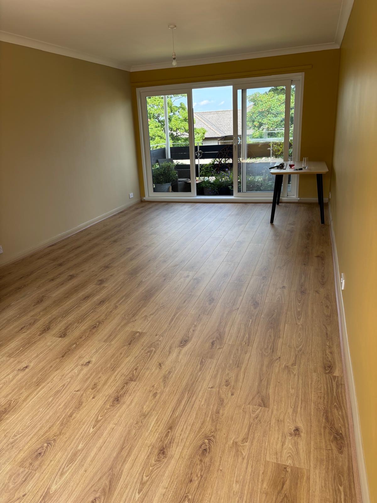 Engineered oak plank flooring leading towards glazed doors in Haddington