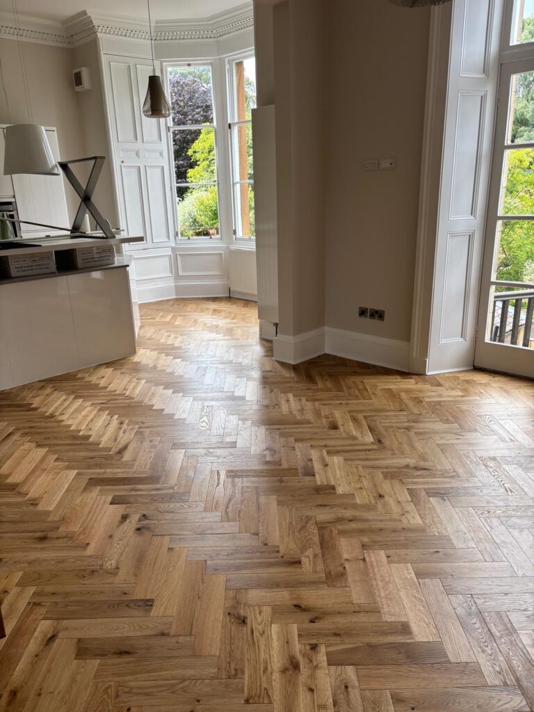 Finished herringbone wood flooring in an Edinburgh period home by Build-Able