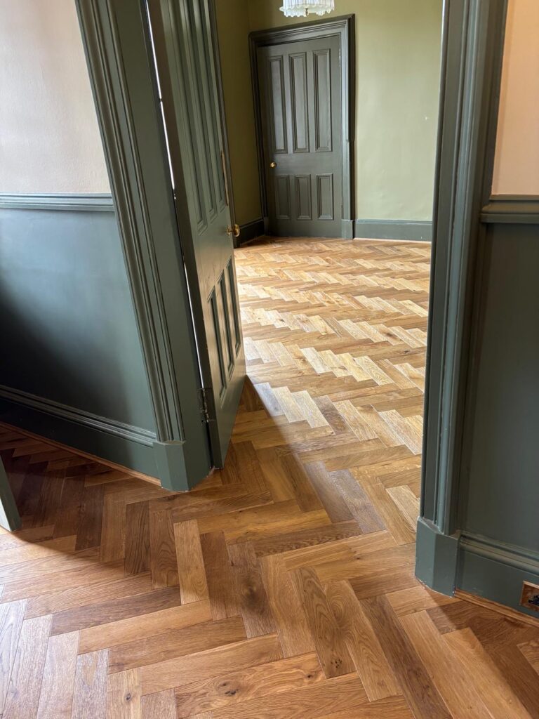 Professional herringbone wood flooring installation by Build-Able in a period property