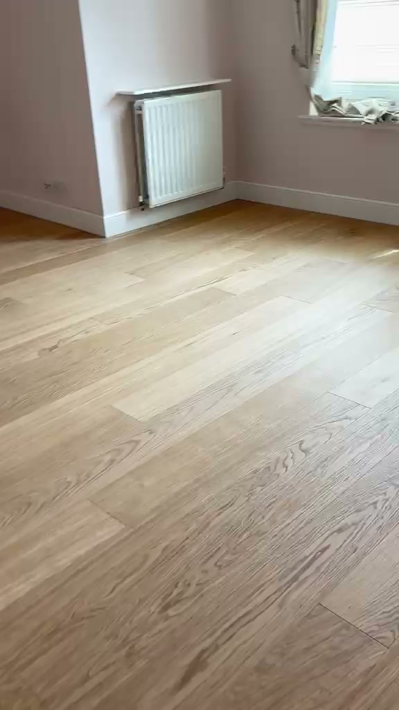 Finished wood-effect LVT click flooring in a Gullane room